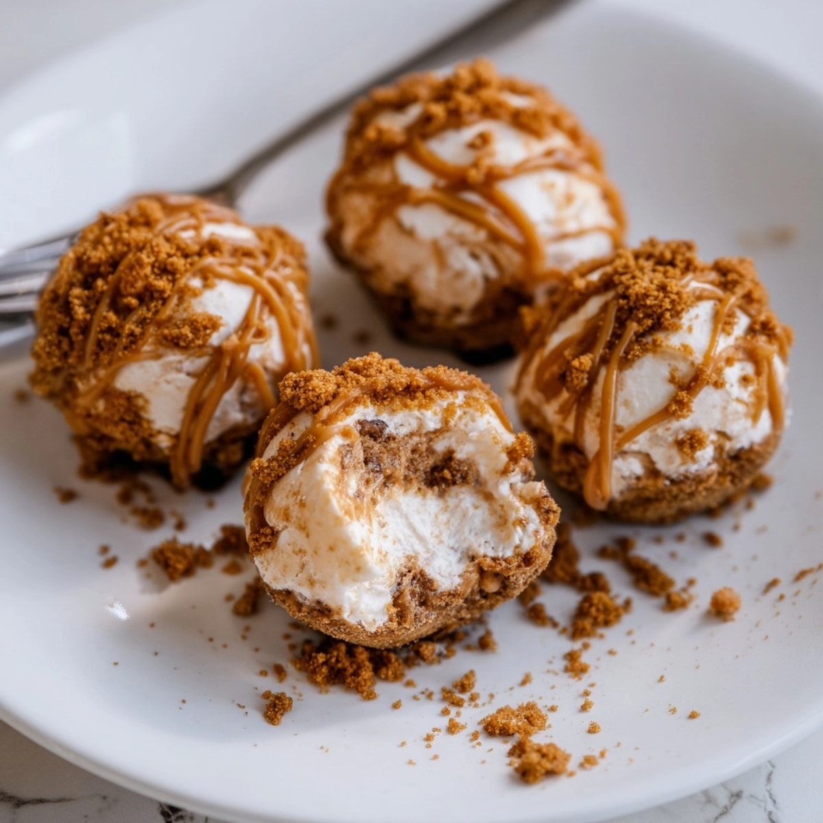 Creamy Biscoff Cheesecake Balls recipe photo, coated in crunchy crumbs, ready to serve.