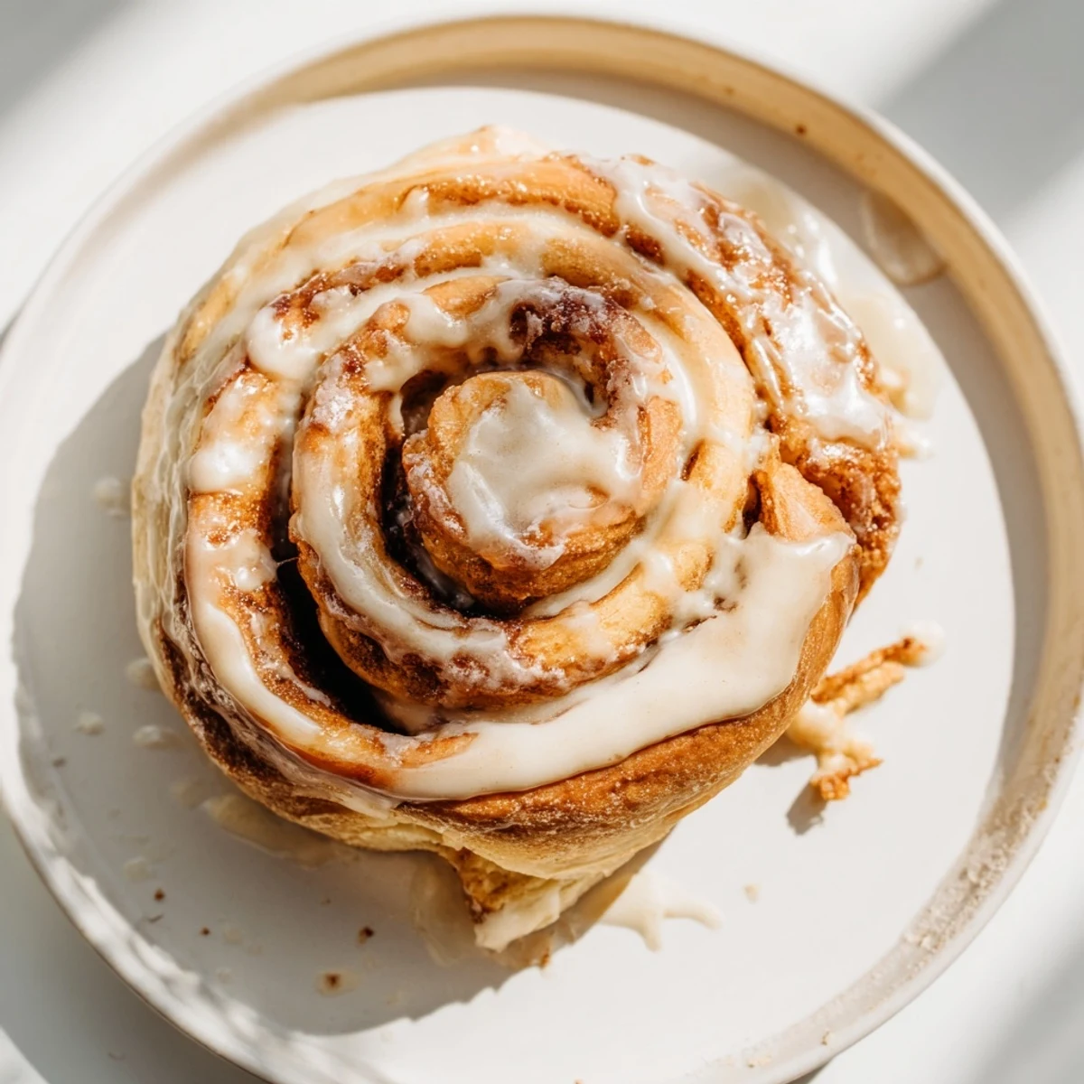 Warm, golden Baked Goodness cinnamon rolls, swirled with brown sugar, drizzled with vanilla glaze.