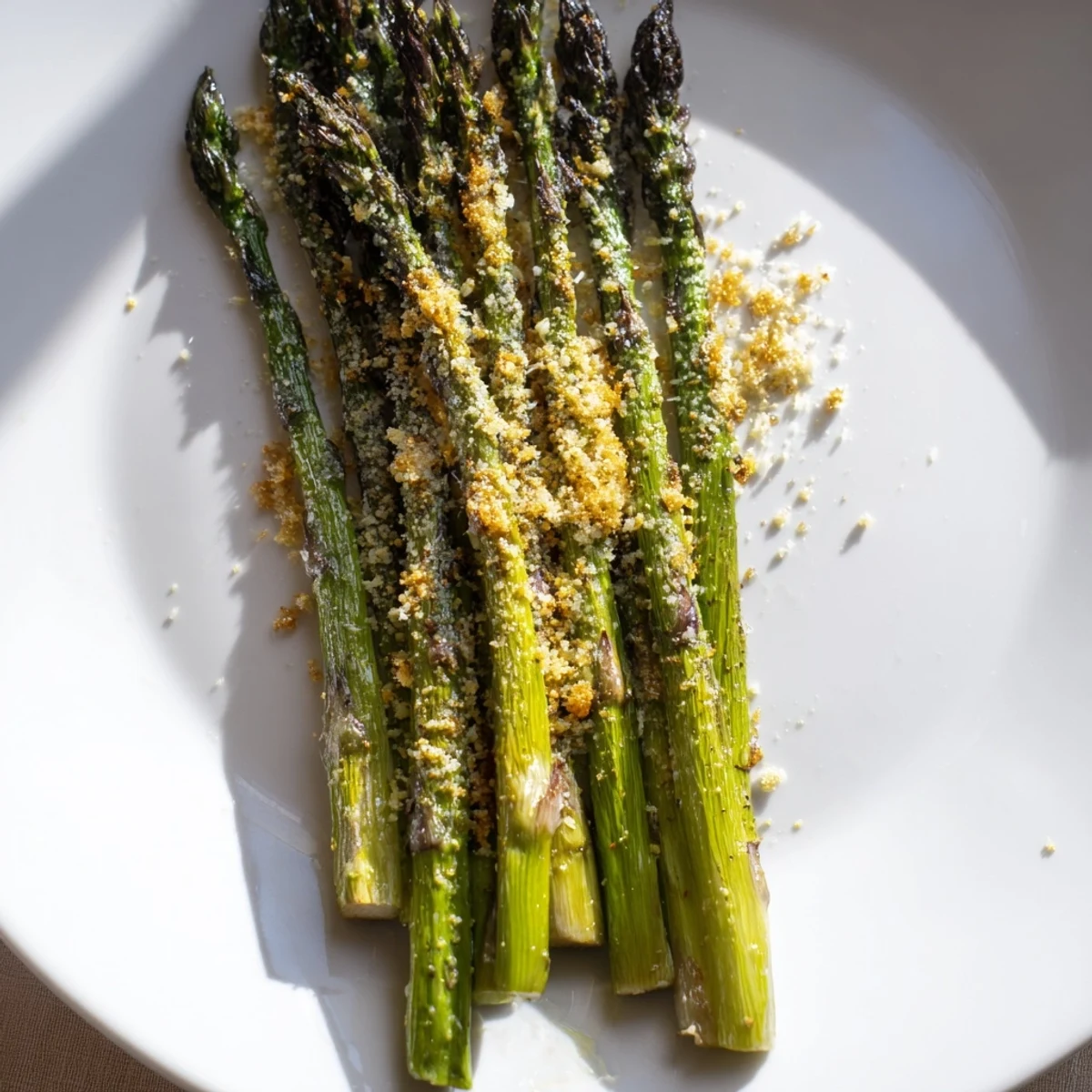 Beautifully roasted asparagus with parmesan cheese, presented as a simple, flavorful Italian side.