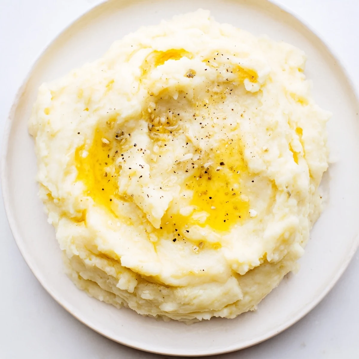 Fluffy Garlic Parmesan Mashed Potatoes, garnished with parsley, ready to serve as a side.