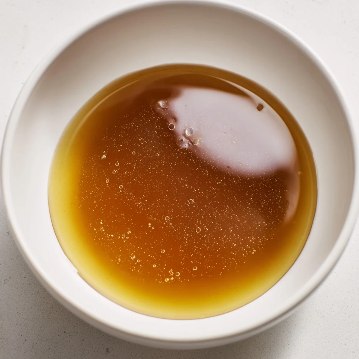 A close-up of a rich, homemade beef stock pot, ready for creating delicious recipes.