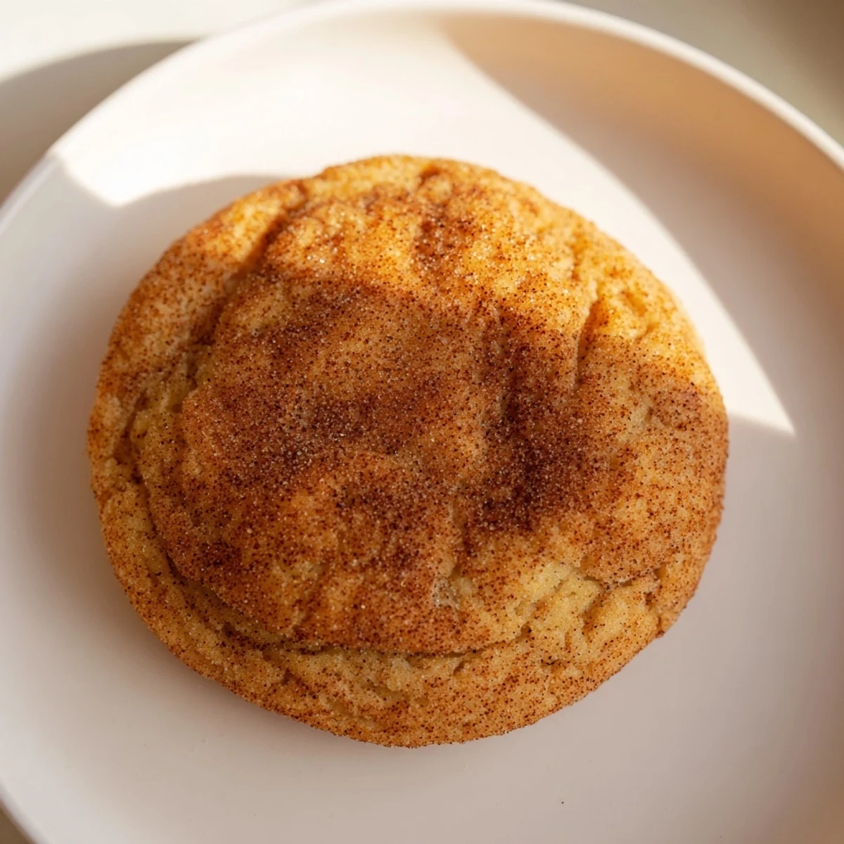 Close-up shot shows a stack of soft, delicious Snickerdoodle cookies, perfect for dessert tonight.