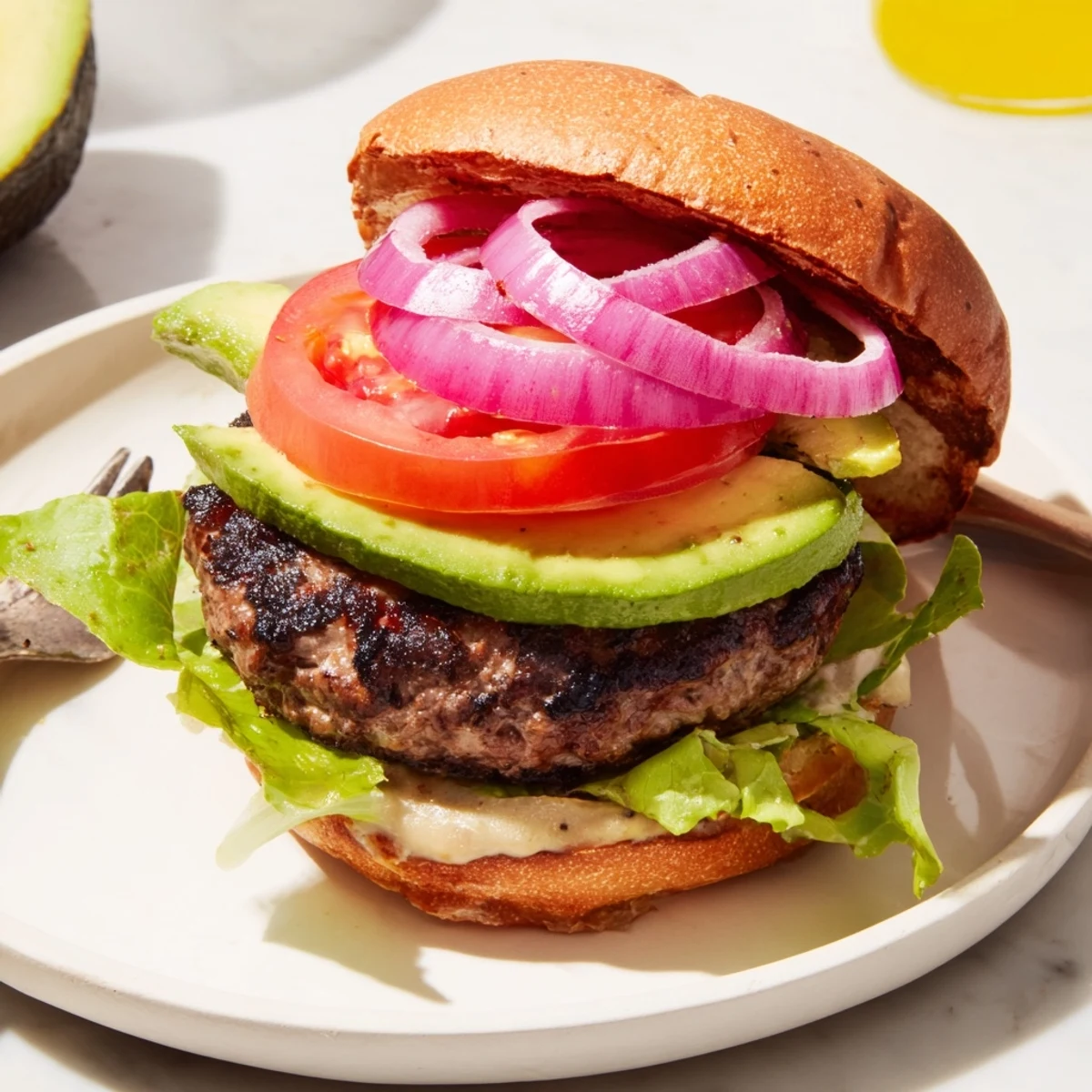 Juicy Avocado Burger with melted cheese, vibrant tomato slices, and fresh lettuce ready to enjoy.