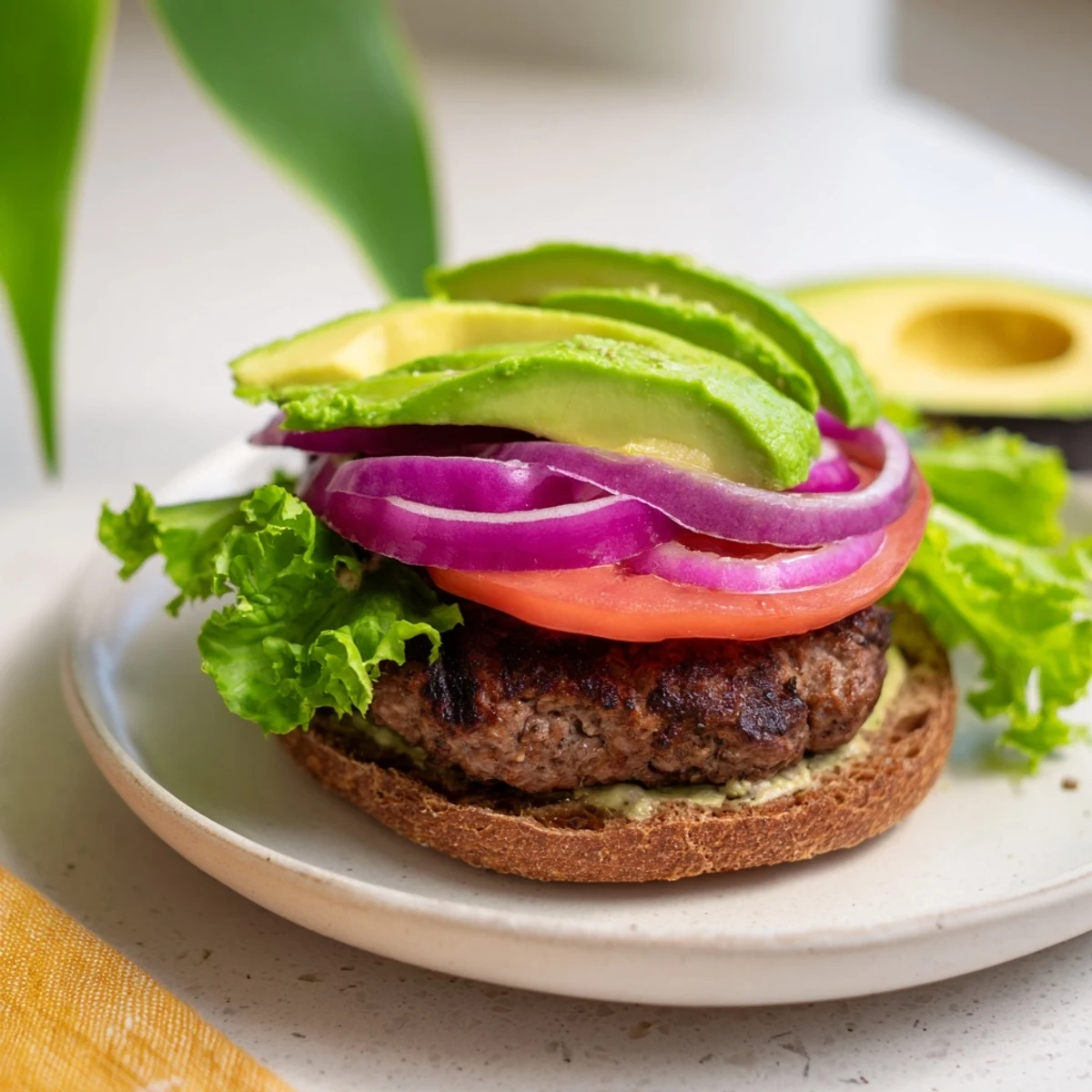Homemade Avocado Burger with toppings, showcasing a fresh, healthy, and perfectly crafted main dish.
