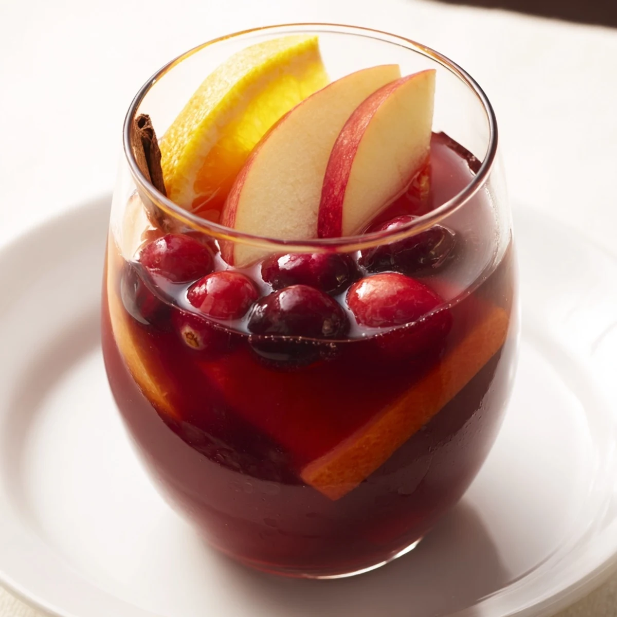 Steaming Spiced Holiday Punch, garnished with orange slices, ready to warm your holiday gatherings.