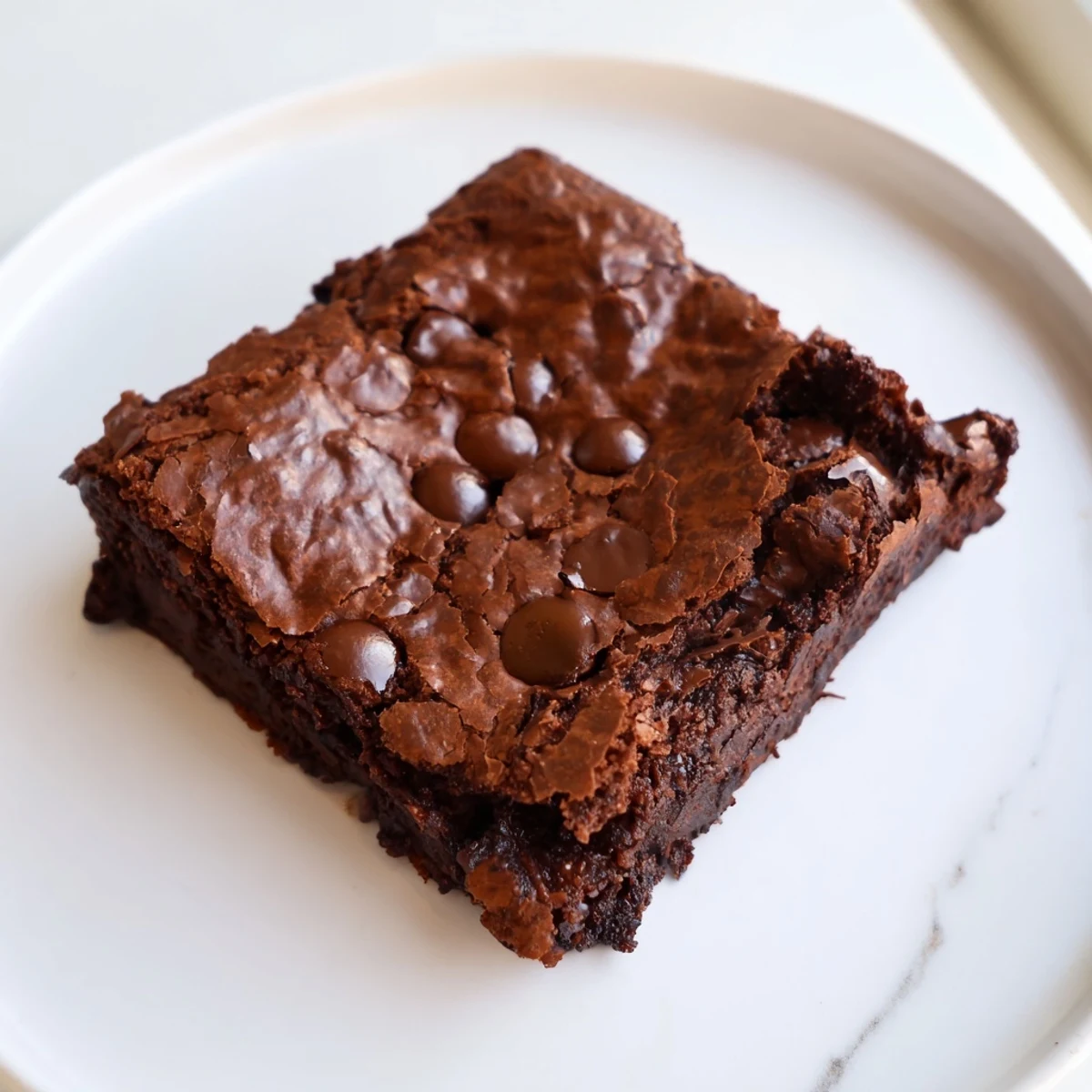 Fudgy chocolate brownies, rich and dark, baked to perfection with melty chocolate chips.