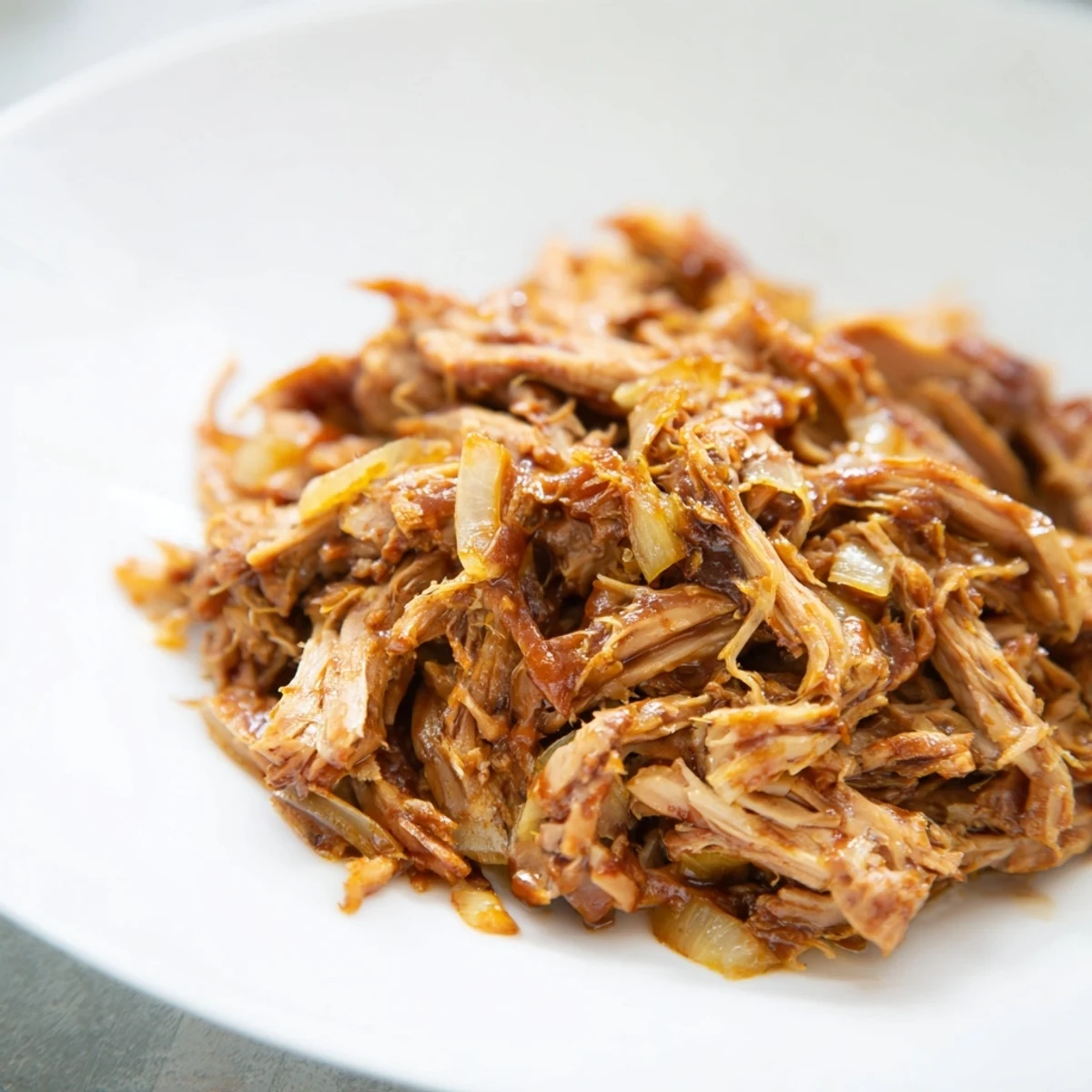 Imagine the tender Slow Cooked Pork-Free Pulled Jackfruit: Plant-based, tangy, and ready for tacos or bowls.