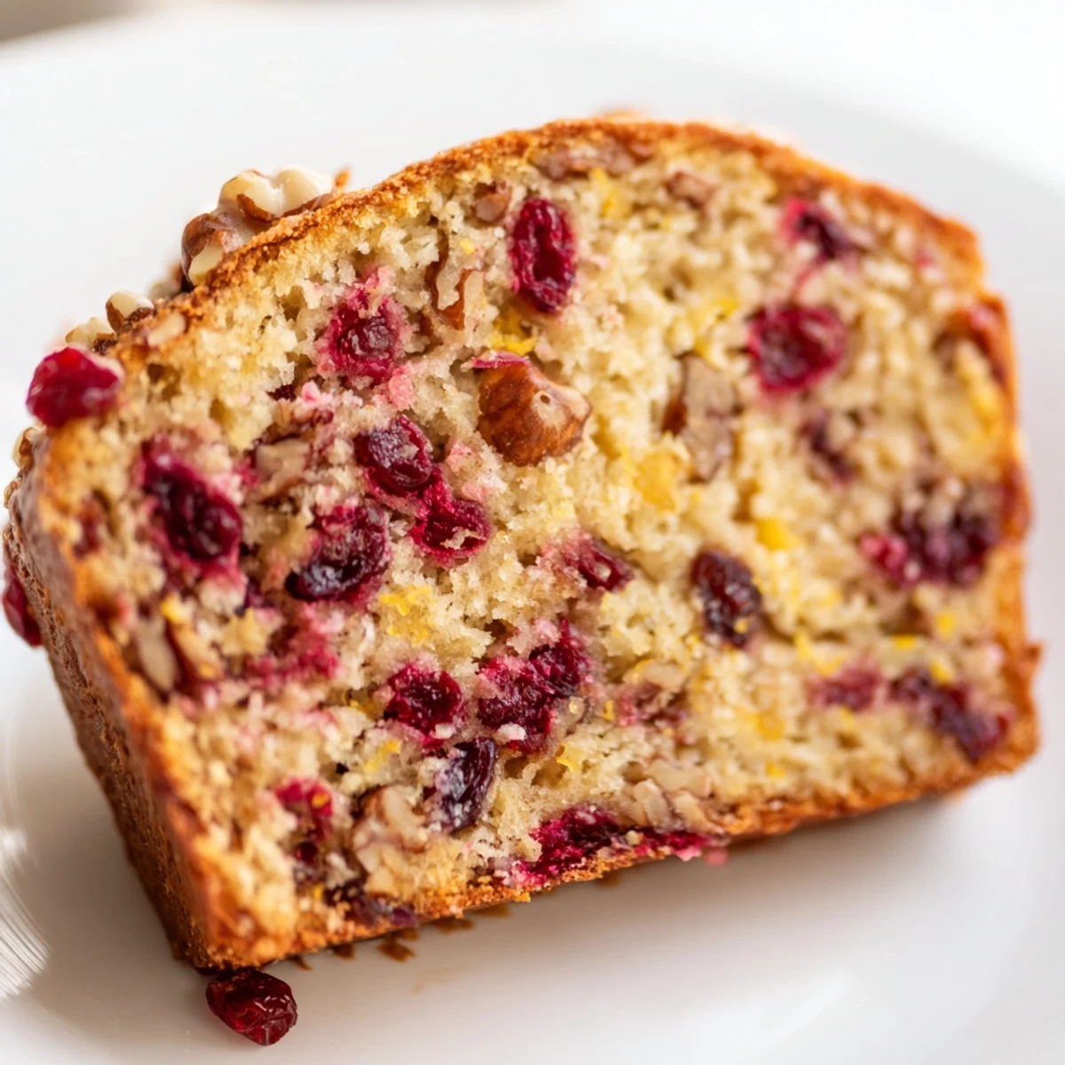 Homemade Cranberry Bread with Nuts loaf wrapped in rustic cloth, ready to be sliced for a cozy breakfast or afternoon snack.