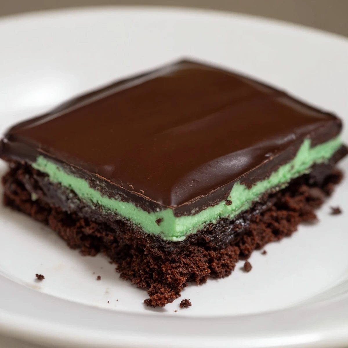 Shamrock Mint Brownies with Chocolate Ganache display fudgy layers and glossy topping, ideal for St. Patrick's Day celebrations.
