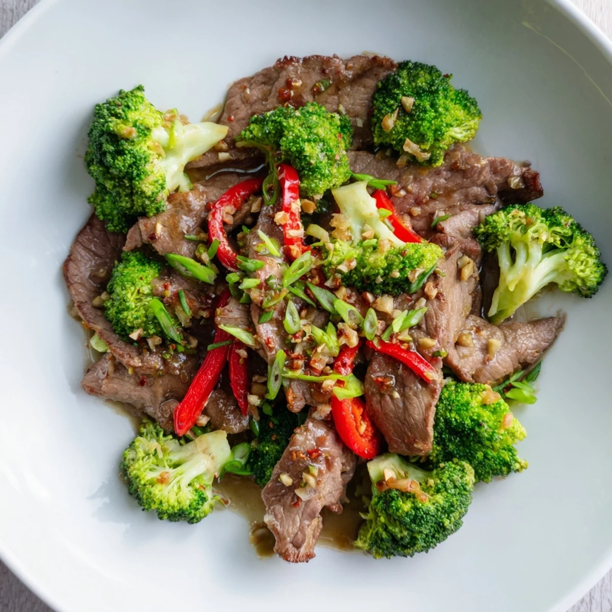 Sizzling slices of beef and crisp broccoli florets in a bold, glossy Spicy Beef and Broccoli Stir Fry.