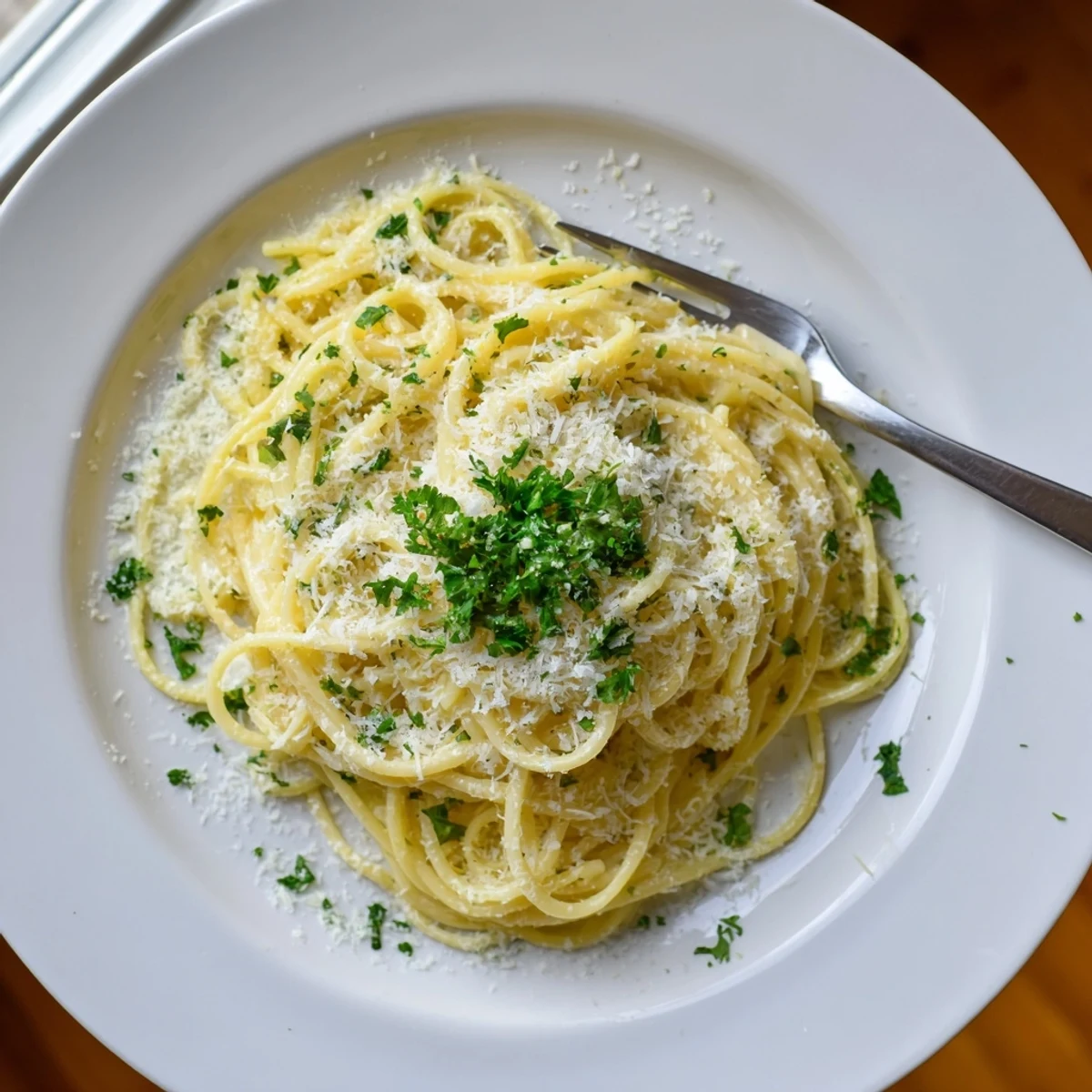 Steaming plate of one pot garlic butter pasta featuring al dente noodles coated in rich garlic butter