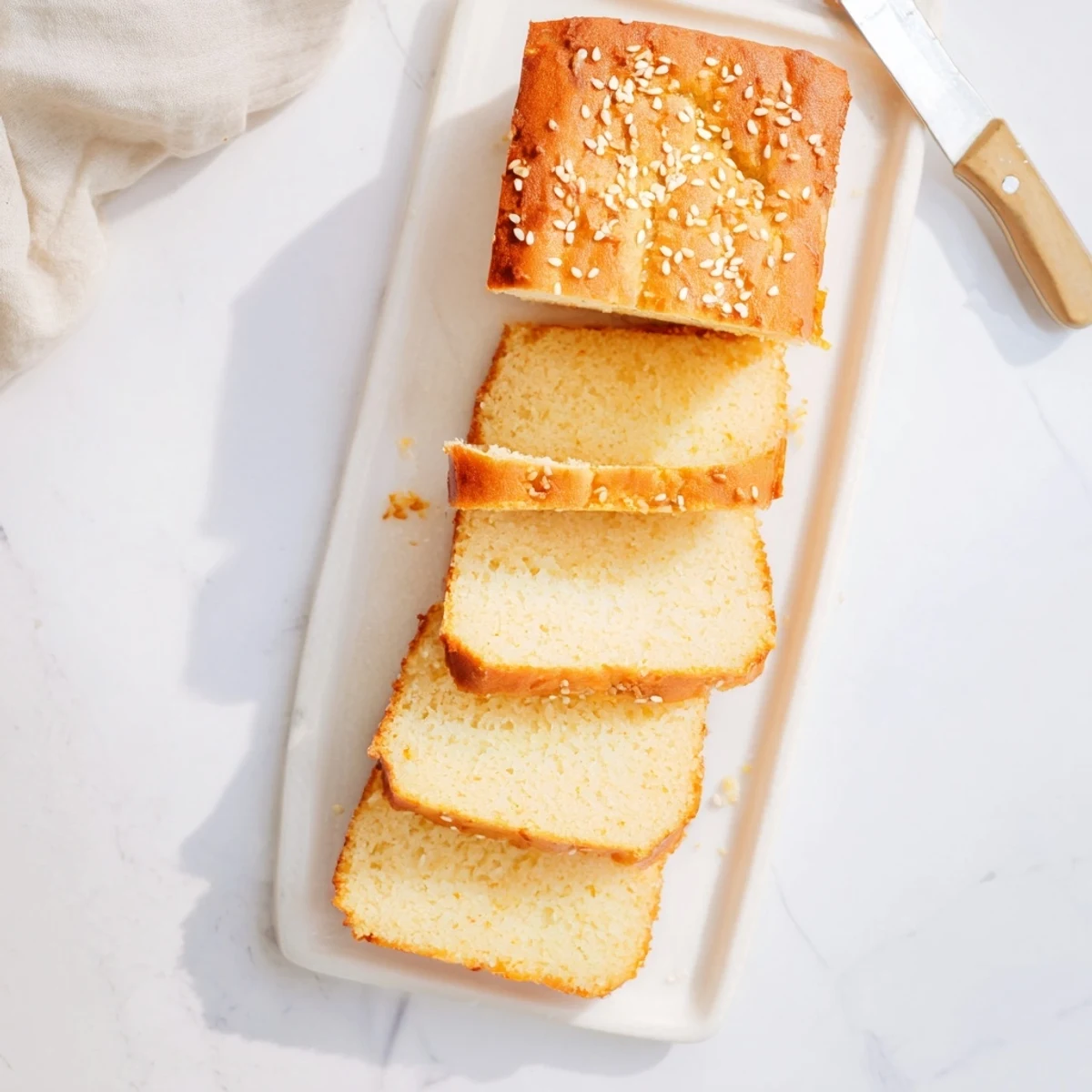 Fluffy keto zero carb yogurt bread photographed from above with golden crust and soft white interior