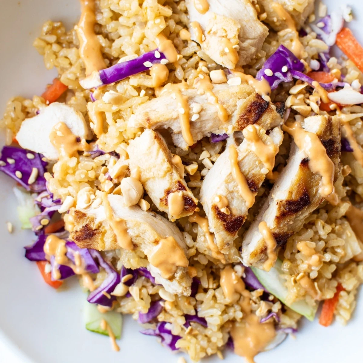 Colorful fresh vegetables and crispy rice in vibrant Asian Bang Bang Chicken salad bowl