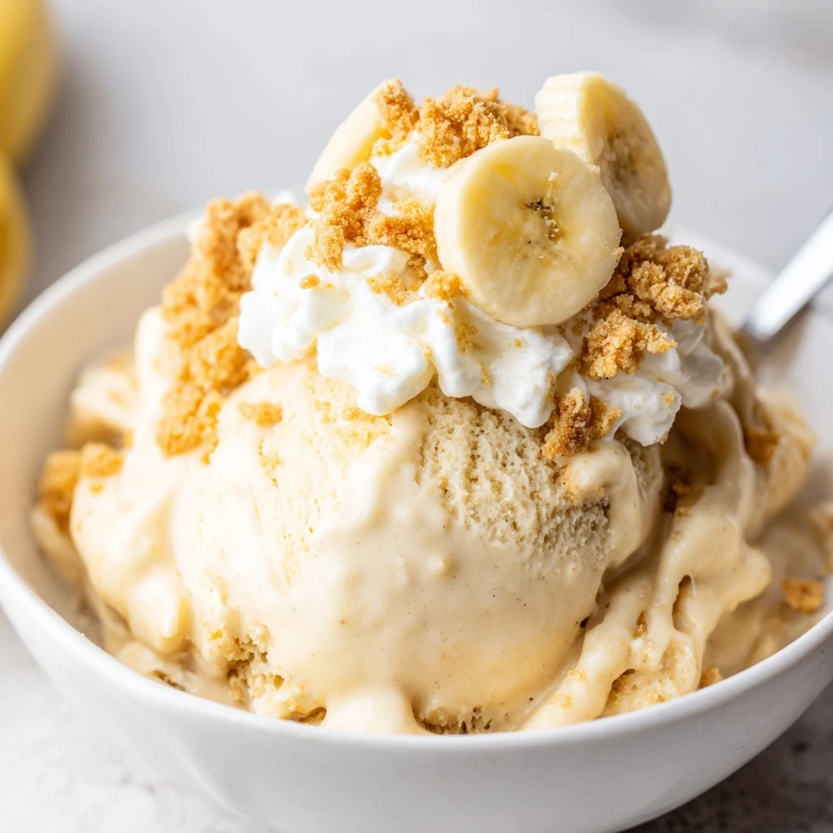 Silky frozen Ninja Creami Banana Cream Pie Ice Cream studded with graham crumble