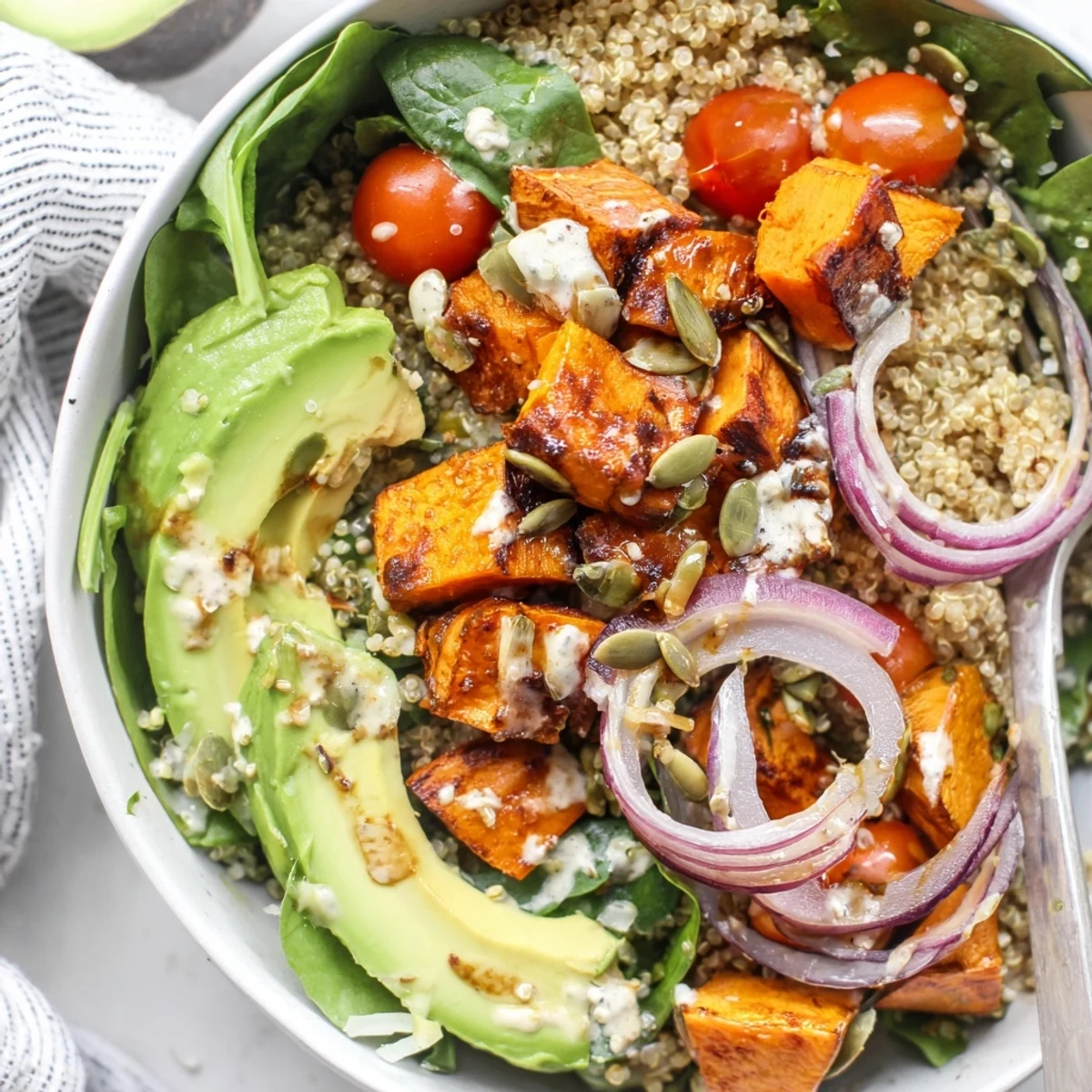 Roasted Sweet Potato Quinoa Salad Bowl with bright lemon-tahini drizzle and creamy avocado