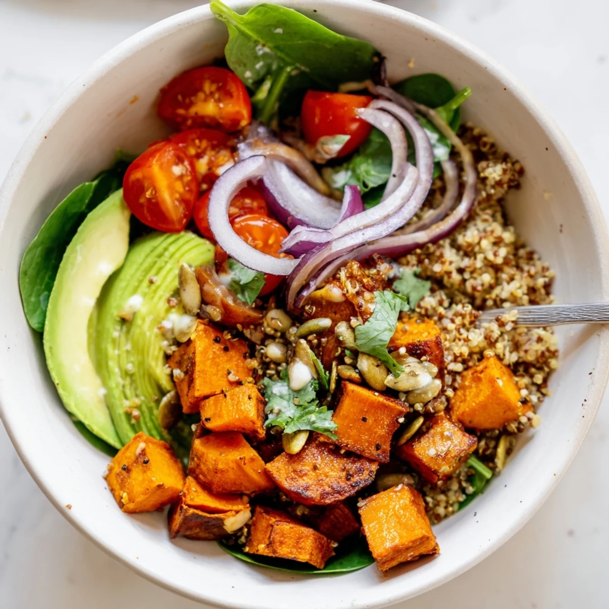 Roasted Sweet Potato Quinoa Salad Bowl served warm as a light, nourishing lunch