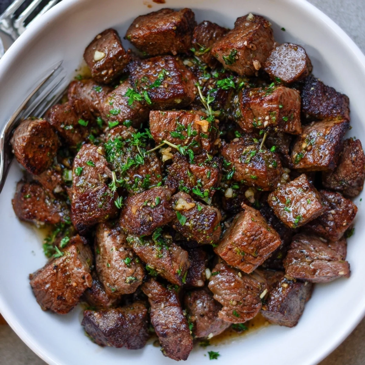 Sizzling, tender Garlic Butter Steak Bites tossed in glossy herb butter, skillet-seared