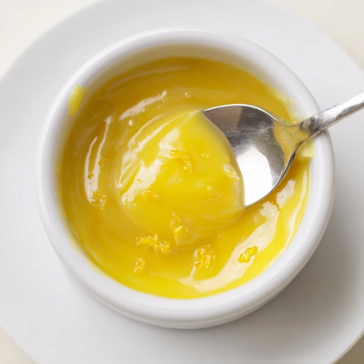 Homemade Lemon Curd Recipe spooned over warm scones with zesty aroma