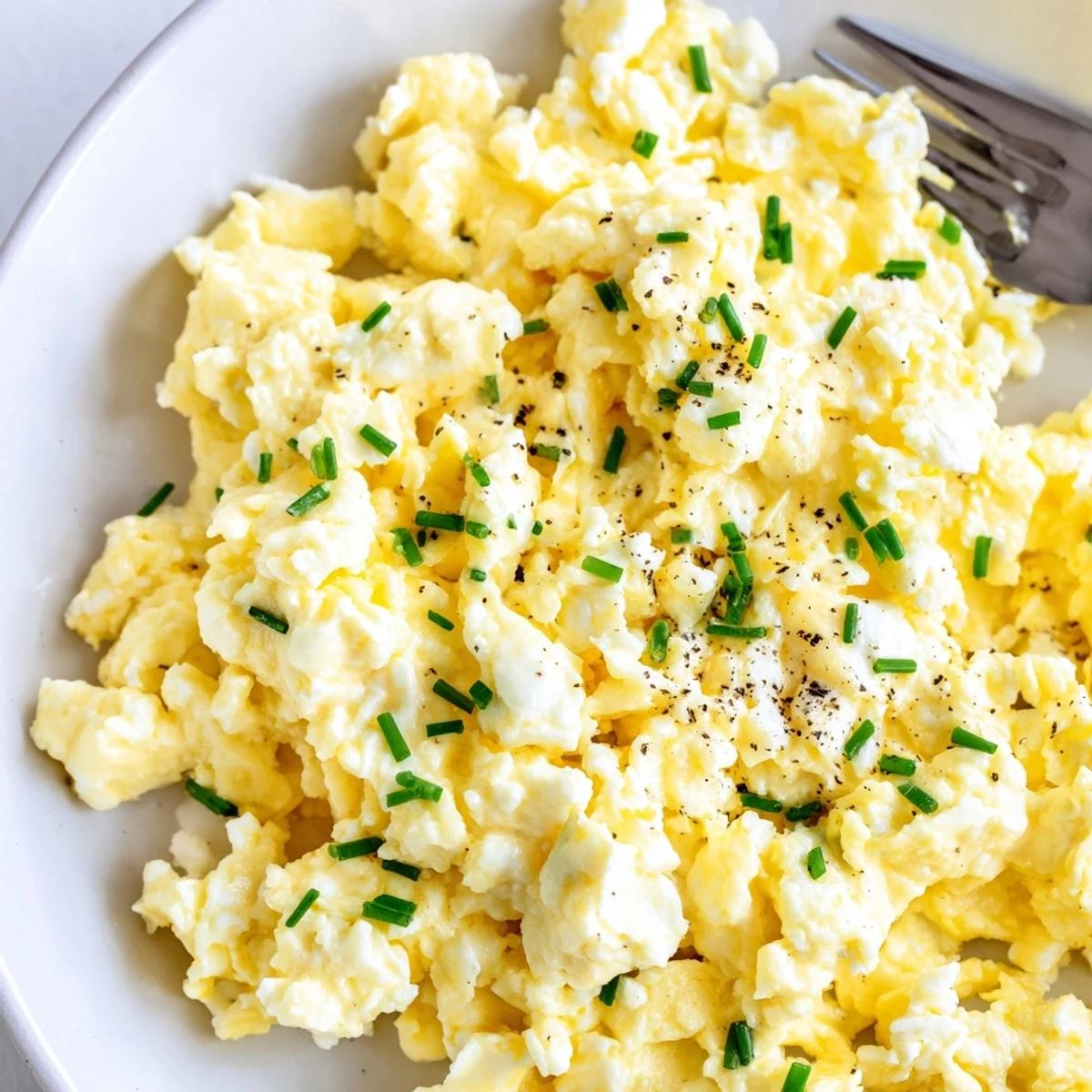 Cottage Cheese Scrambled Eggs With Chives served on toast, bright herb aroma.