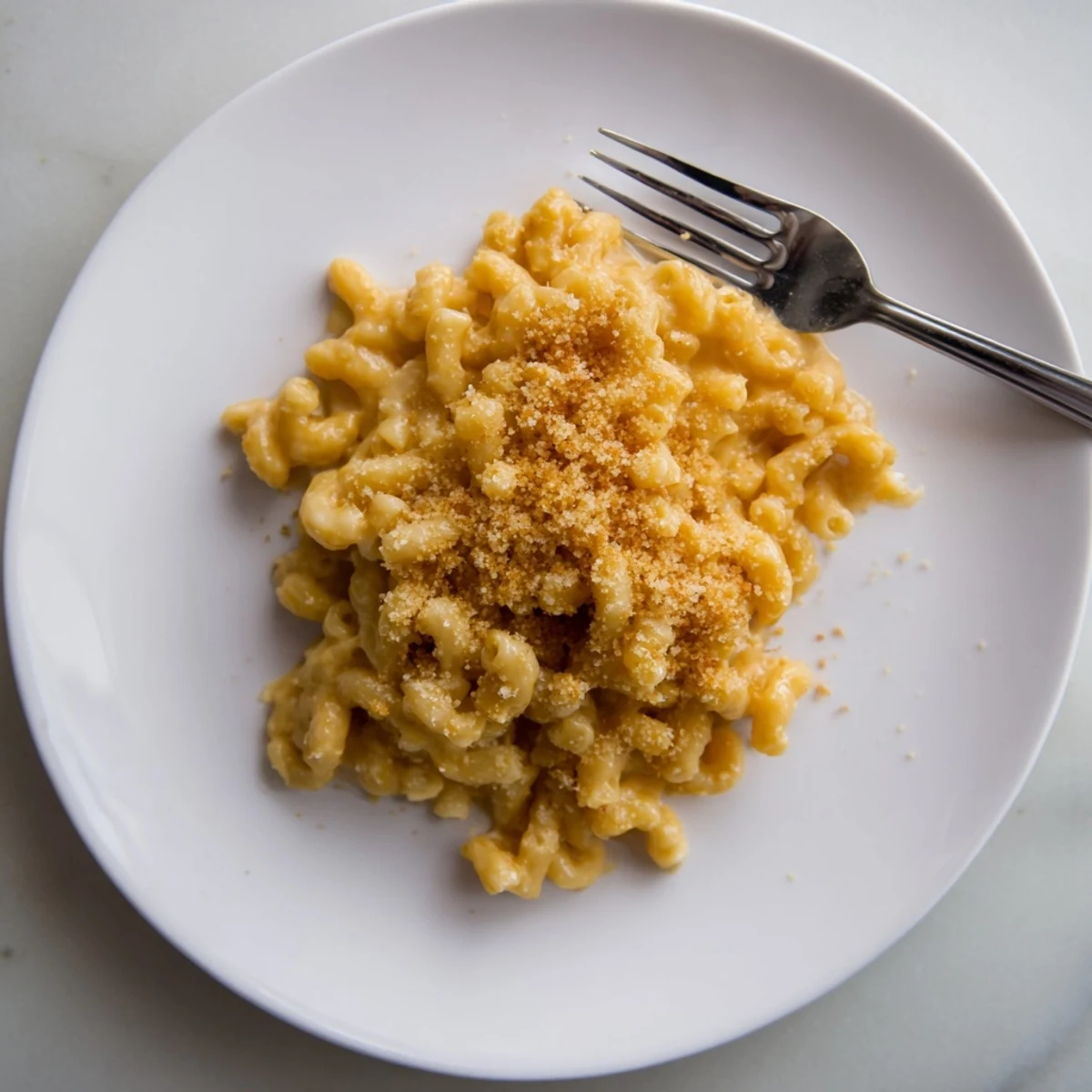 Oven-baked mac and cheese casserole with golden breadcrumb crust and rich cheese sauce