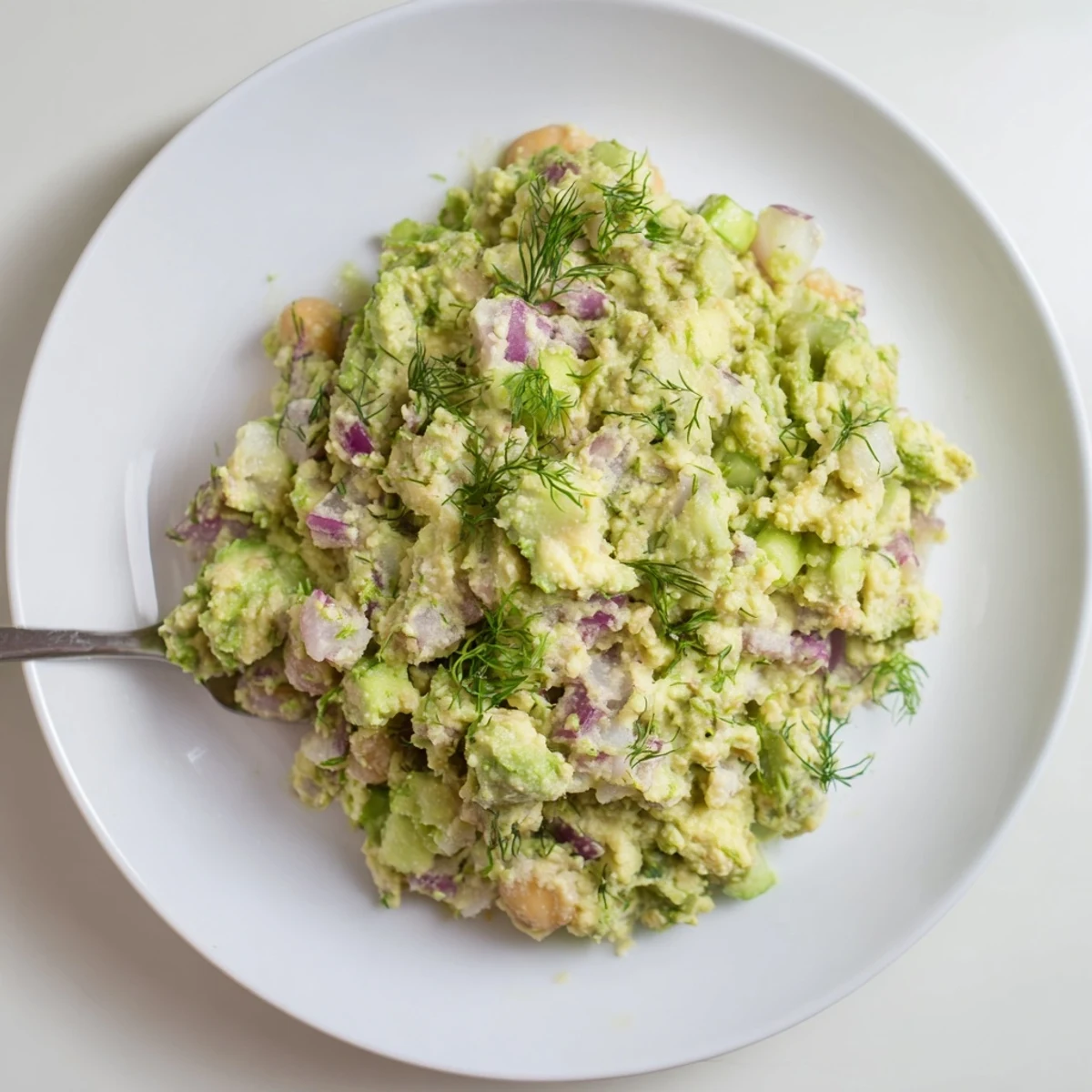 Creamy Smashed Chickpea Avocado Pickle on toast with dill and lemon