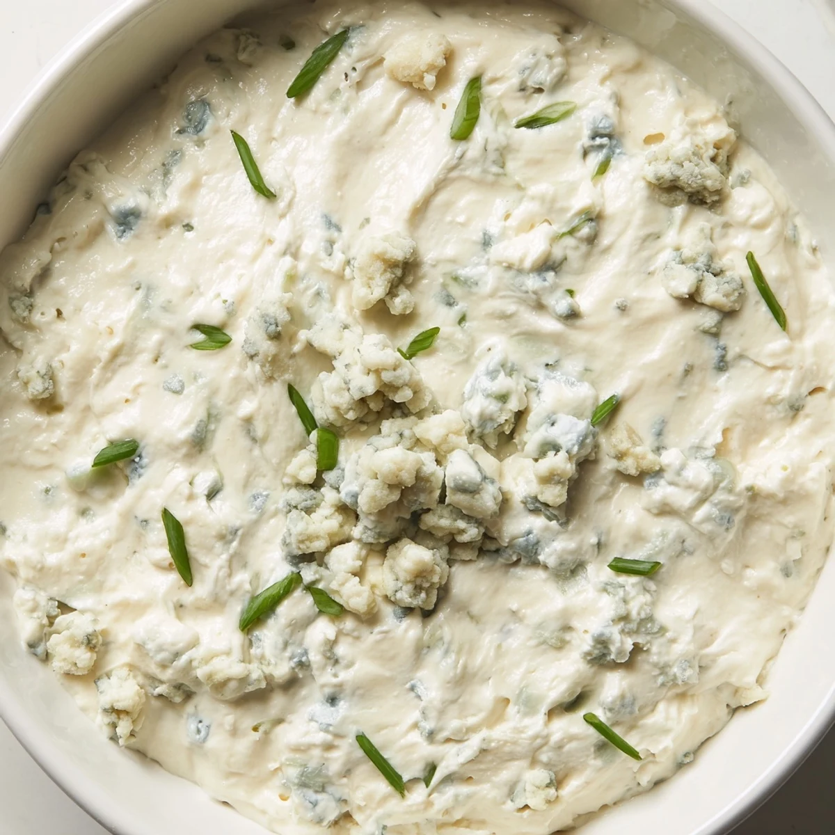 Rich and tangy blue cheese dip paired with crispy buffalo wings and crackers