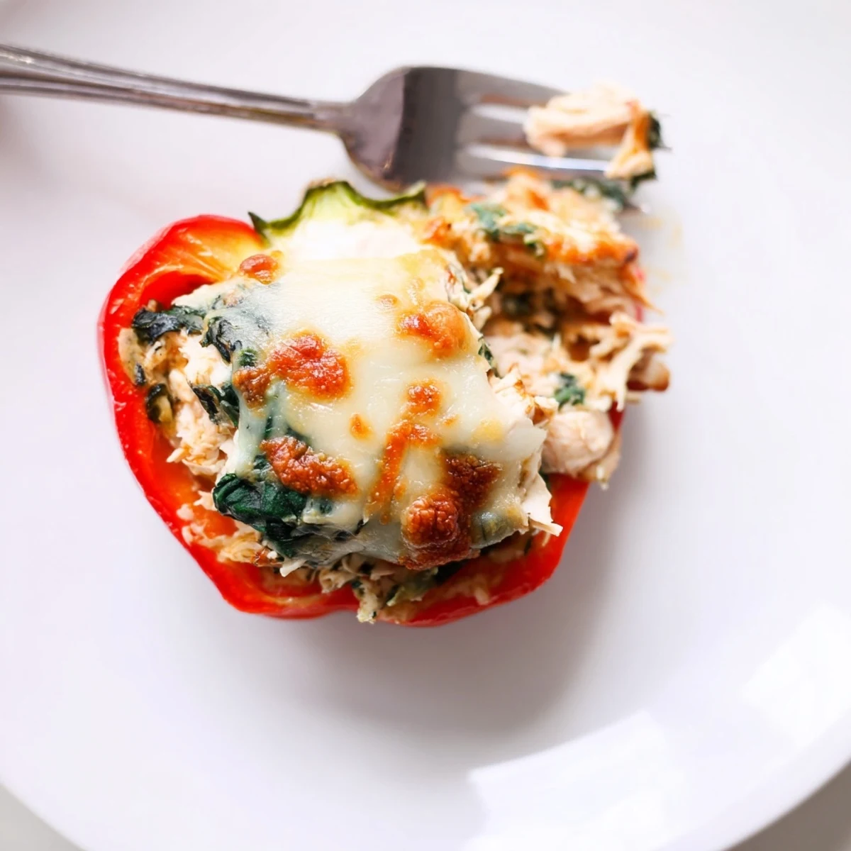 Baked Chicken Florentine Stuffed Peppers topped with melted mozzarella and fresh Italian herbs  